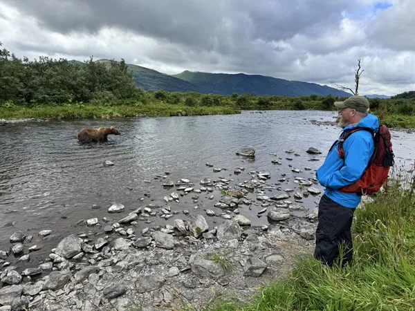 Watching a bear from the riverbank