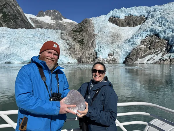 Holding a chunk of glacier ice